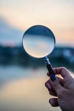 selective-focus-photo-of-magnifying-glass-1194775